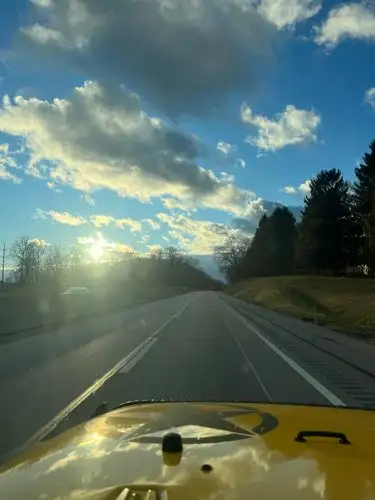 The open road meets a golden hour sky.